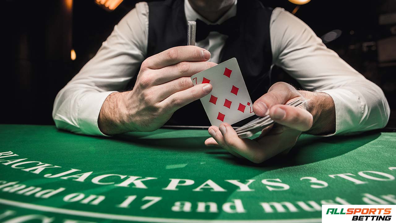 blackjack male live dealer dealing cards